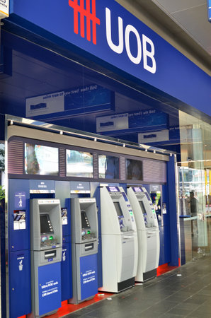 SINGAPORE- MAY 01, 2017: ATM of United Overseas Bank UOB in Singapore, one of the largest banks in South-East Asiaのeditorial素材