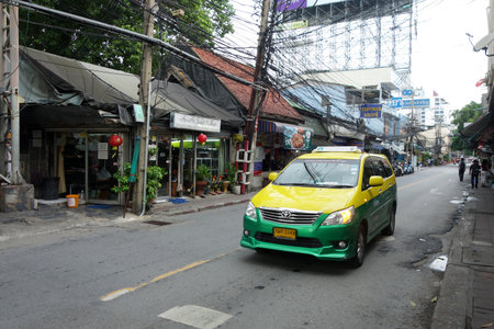 BANGKOK, THAILAND- 20 MAY, 2017: Typical Taxi ride in downtown area of Bangkok, Thailand without passenger. Even though public transportation develops quite well in Bangkok, however traffic congestion is still not smooth.のeditorial素材