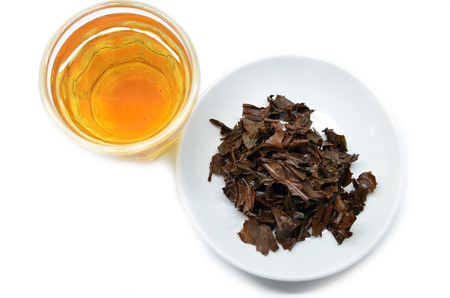  Tea in a glass cup with used tea leave.  