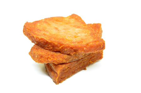 Pan fried slices of luncheon meat isolated on white backgroundの写真素材