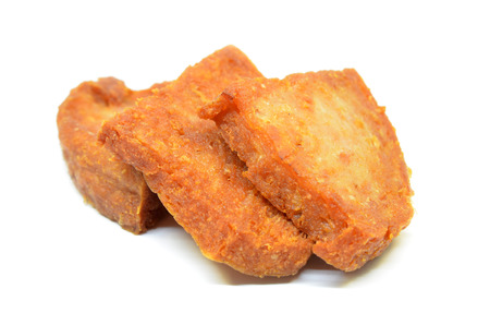 Pan fried slices of luncheon meat isolated on white background