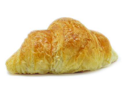 Fresh Croissant isolated on white background. Croissant is a French crescent-shaped roll made of sweet flaky pastry often eaten for breakfast.の写真素材