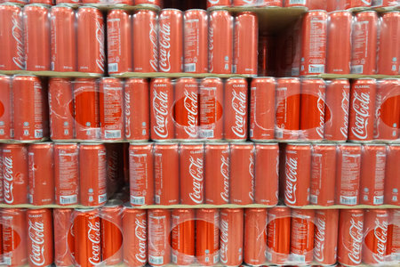 SINGAPORE- NOV 11, 2017: Grocery store shelf with cans of coca cola classical. Coke products were sold in over 200 countries worldwide.のeditorial素材