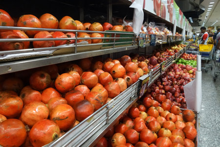 SINGAPORE- NOV 11, 2017: Assorted fruits sold on a rack in a supermarket in Singapore.のeditorial素材