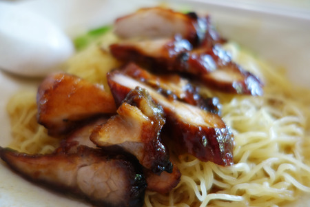 Popular Singapore Chinese street food, wantan mee, kind of noodles serve with bbq porkの写真素材