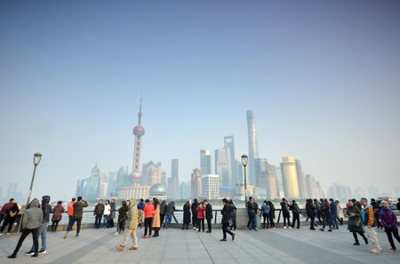 SHANGHAI, CHINA- JAN 08, 2018: Unidentified people in a The Bund in Shanghai China. The Bund or Waitan is a waterfront area in central Shanghaiのeditorial素材