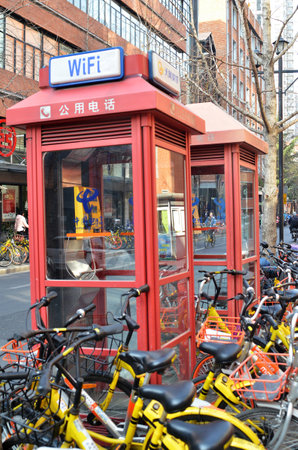 SHANGHAI, CHINA- JAN 08, 2018: Phone booths locate in Shanghai, China. As cell phone getting more popular phone booth is rarely seen today.のeditorial素材