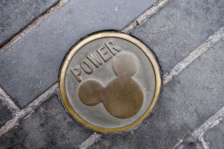 SHANGHAI, CHINA-JAN 08, 2018: Power hole cover with Mickey Mouse imprinted in Disneyland park in Shanghai, China. Shanghai Disneyland Park is a theme park located in Pudong, Shanghaiのeditorial素材