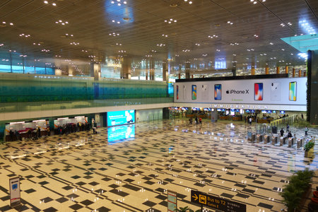 SINGAPORE-JAN 08, 2018: People in Changi International Airport arrival hall. Changi Airport serves more than 100 airlines operating 6100 weekly flightsのeditorial素材