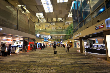 SINGAPORE-JAN 14, 2018: Visitors walk around Departure Hall in Changi Airport. It has 4 passenger terminals and is one of the largest transportation hubs in Asiaのeditorial素材