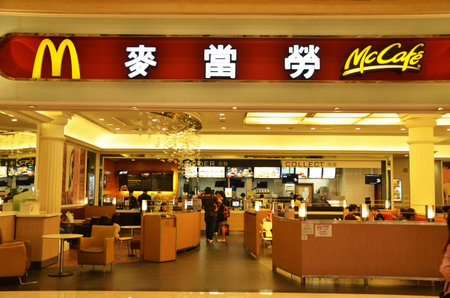 MACAU, CHINA- 7 APR, 2018: Interior of McDonald's restaurant. McDonald's primarily sells hamburgers, cheeseburgers, chicken, french fries, breakfast items, soft drinks, milkshakes, and dessertsのeditorial素材