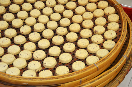 MACAU, CHINA- 07 APR, 2018: Almond cookies from Koi Kei placed on the basket. Koi Kei Bakery is a chain of food souvenir shops based in Macauのeditorial素材
