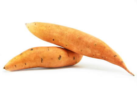 Sweet potatoes isolated on a white backgroundの写真素材