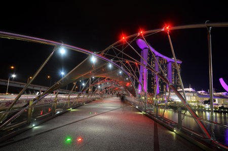 SINGAPORE-JUNE 17, 2018:  Amazing night view of beautiful bridge at the Marina Bay area, Singapore at night.のeditorial素材