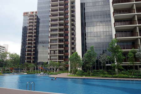SINGAPORE - JUN 26, 2018: Typical Singapore high rise housing estate with big swimming pool.のeditorial素材
