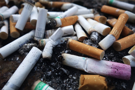 SINGAPORE- JUL 16 2018: The ashtray at the public smoking area that full of cigarette butts.のeditorial素材