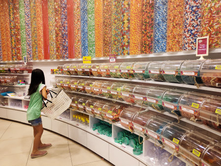 SINGAPORE - 09 SEP 2018: Thousands of different types of colorful candy are stored in gigantic containers in Candylicious, Singapore.のeditorial素材
