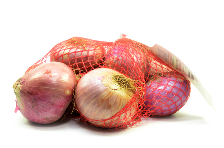 Pack of red onions isolated on white background