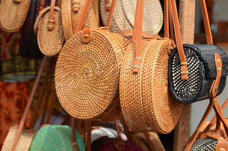 Balinese handmade rattan eco bags in a local souvenir market in Bali, Indonesiaの写真素材