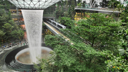 SINGAPORE, 11 Apr, 2019: The Rain Vortex, a 40m-tall indoor waterfall located inside the Jewal Changi Airport in Singapore. Jewel Changi Airport is set to open on April 17, 2019.のeditorial素材