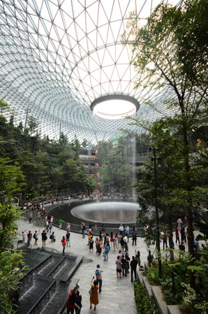 SINGAPORE, 11 Apr, 2019: The Rain Vortex, a 40m-tall indoor waterfall located inside the Jewal Changi Airport in Singapore. Jewel Changi Airport is set to open on April 17, 2019.のeditorial素材