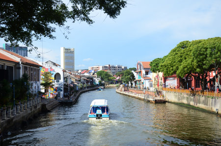 MELAKA, MALAYSIA - 25 JUN, 2019: Cruise crossing by the Malacca River. Melaka has a historical site which was declared as the UNESCO world heritage in 2008のeditorial素材