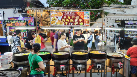 MELAKA, MALAYSIA - 25 JUN, 2019: People enjoy the local food at night market located in Jonker...