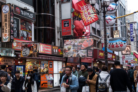 Osaka, Japan- 02 Dec, 2019: Tourist walking around pedestrian walking street at Dotonbori arcade in...