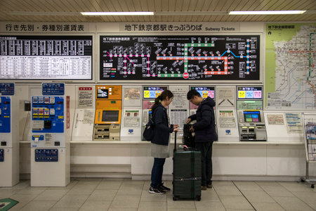 Kyoto, Japan- 27 Nov, 2019: Passengers are buying tickets from vending machines inside JR Kyoto...