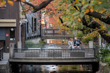 Kyoto, Japan- 26 Nov, 2019: Beautiful view of Takase River with autumn leave in Kyoto, Japan. It is alongside Kiyamachi dori, a famous and historically important commercial street in Kyotoのeditorial素材