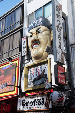 Osaka, Japan- 03 Dec, 2019: Shinsekai Ganso Kushikatsu Daruma store sign in Dotonburi, Osaka.のeditorial素材
