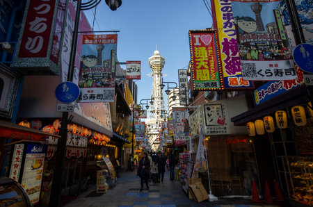 Osaka, Japan- 01 Dec, 2019: Street view of Shinsekai and Tsutenkaku tower in Osaka. Shinsekai is a retro downtown area of southern Osakaのeditorial素材