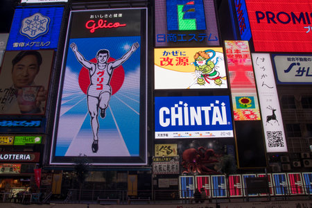 Osaka, Japan- 28 Nov, 2019: The Glico Man advertising billboard and other advertisemant in Dontonbori, Osaka. Glico running man has glowed over the Dotonbori canal district for more than 80 yearsのeditorial素材