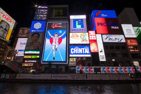 Osaka, Japan- 28 Nov, 2019: The Glico Man advertising billboard and other advertisemant in Dontonbori, Osaka. Glico running man has glowed over the Dotonbori canal district for more than 80 yearsのeditorial素材