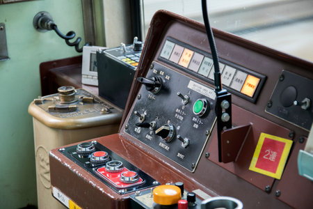 Kyoto, Japan- 26 Nov, 2019: Control panel systems of a vintage train in Kyoto, Japan. Trains are a...