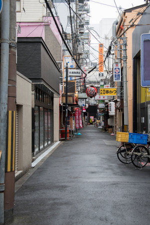 Osaka, Japan- 28 Nov, 2019: Clean and quiet Japan street in the morning in Osaka. Osaka is well-known for its modern architecture, nightlife and hearty street foodのeditorial素材