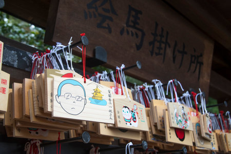 Kyoto, Japan- 25 Nov, 2019: Ema praying tablets at Shinto Shrine, Kinkaku-ji. Ema are small wooden plaques used for wishes by shinto believers.のeditorial素材