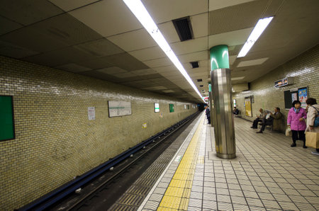 Osaka, Japan- 28 Nov, 2019: People waiting for the subway on a platform in Osaka. Osaka is the second largest metropolitan area in Japanのeditorial素材