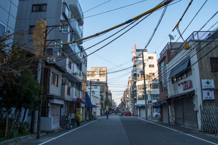 Osaka, Japan- 01 Dec, 2019: View of office building and shop houses at Tennoji area on bright blue sky background in Osakaのeditorial素材