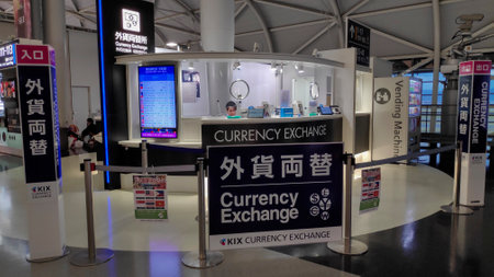 Osaka, Japan- 3 Dec, 2019: Currency exchange services at Kansai Airport. Kansai International Airport (KIX) serves the western area of Japan.のeditorial素材