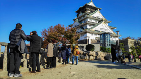 Osaka, Japan- 01 Dec, 2019: Tourist and people visit the Osaka castle in Osaka, Japan. It is the famous landmark and popular tourist destination of Osakaのeditorial素材