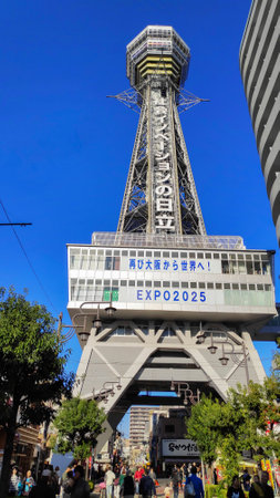 Osaka, Japan- 01 Dec, 2019: Tsutenkaku Tower at Shinsekai area in Osaka, Japan with japanese languages Commercial billboard sign.のeditorial素材