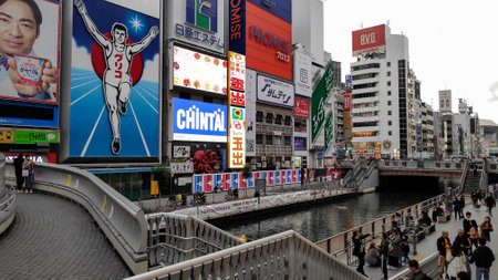 Osaka, Japan- 02 Dec, 2019: Tourist walking around pedestrian walking street at Dotonbori arcade in...