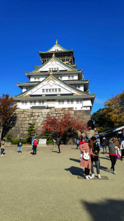 Osaka, Japan- 01 Dec, 2019: Tourist and people visit the Osaka castle in Osaka, Japan. It is the famous landmark and popular tourist destination of Osakaのeditorial素材