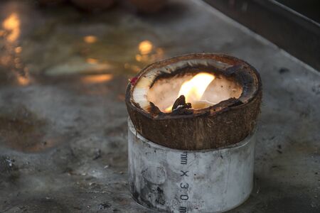 Coconut oil lamps for sacred fire in local Indian templeの写真素材