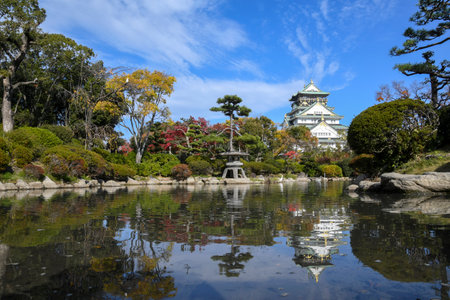 Scenic landscape of Osaka Castle Park, with Osaka Castle reflecting in a pondのeditorial素材