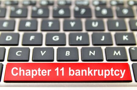 Chapter 11 bankruptcy word on computer keyboard, 3D renderingの写真素材