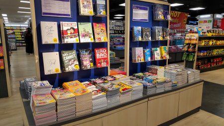 Johor Bahru, Malaysia- 25 Jan, 2020: Book store shelves with rows of various books on display in...