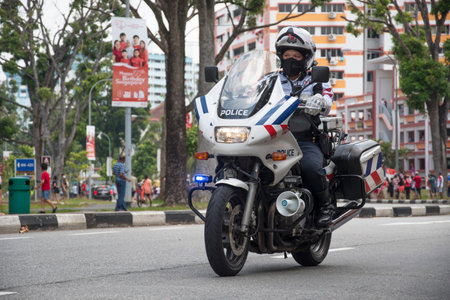 Singapore, 08 Nov, 2020: Unidentified police officer ride motorbike on Singapore National Day Mobile Column.のeditorial素材