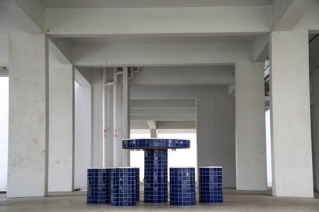 Singapore, 08 Nov, 2020: Stone stools and tables at void deck for residents to mingle. It is located on the ground floor of HDB in Singapore.のeditorial素材